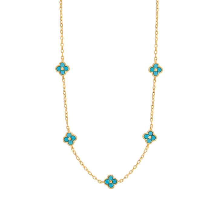 gold plated turquoise clover necklace on white background