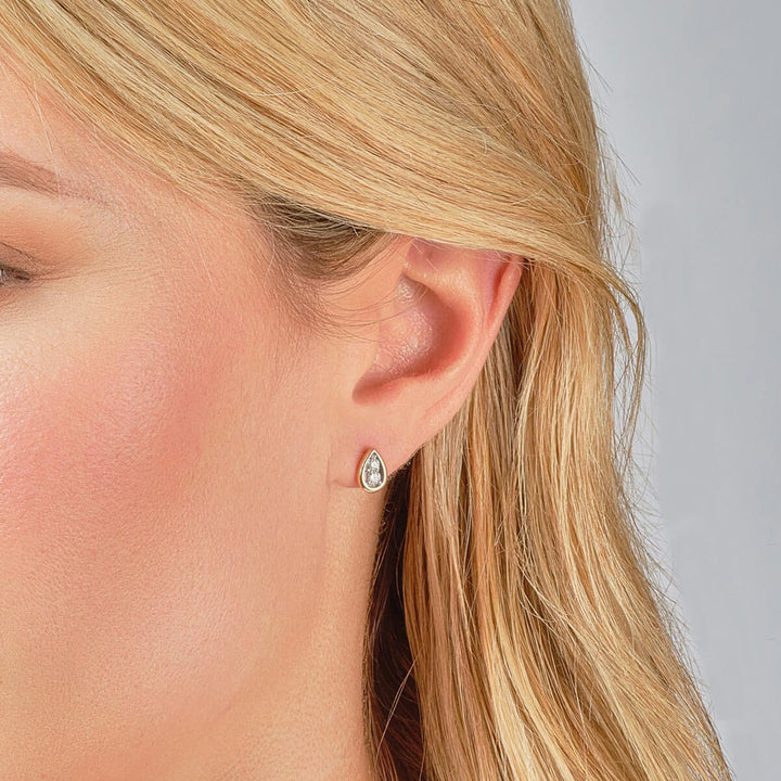 9ct gold diamond stud earrings on model