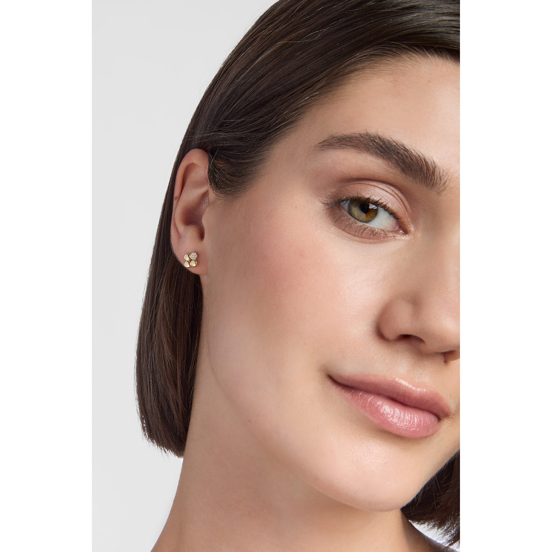 model wearing 9ct gold cubic zirconia flower stud earrings