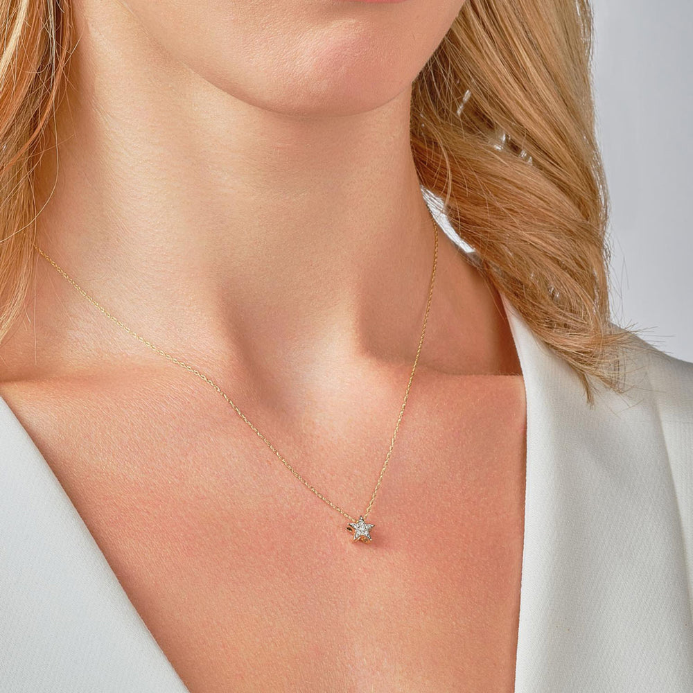 9ct gold diamond star necklace on model