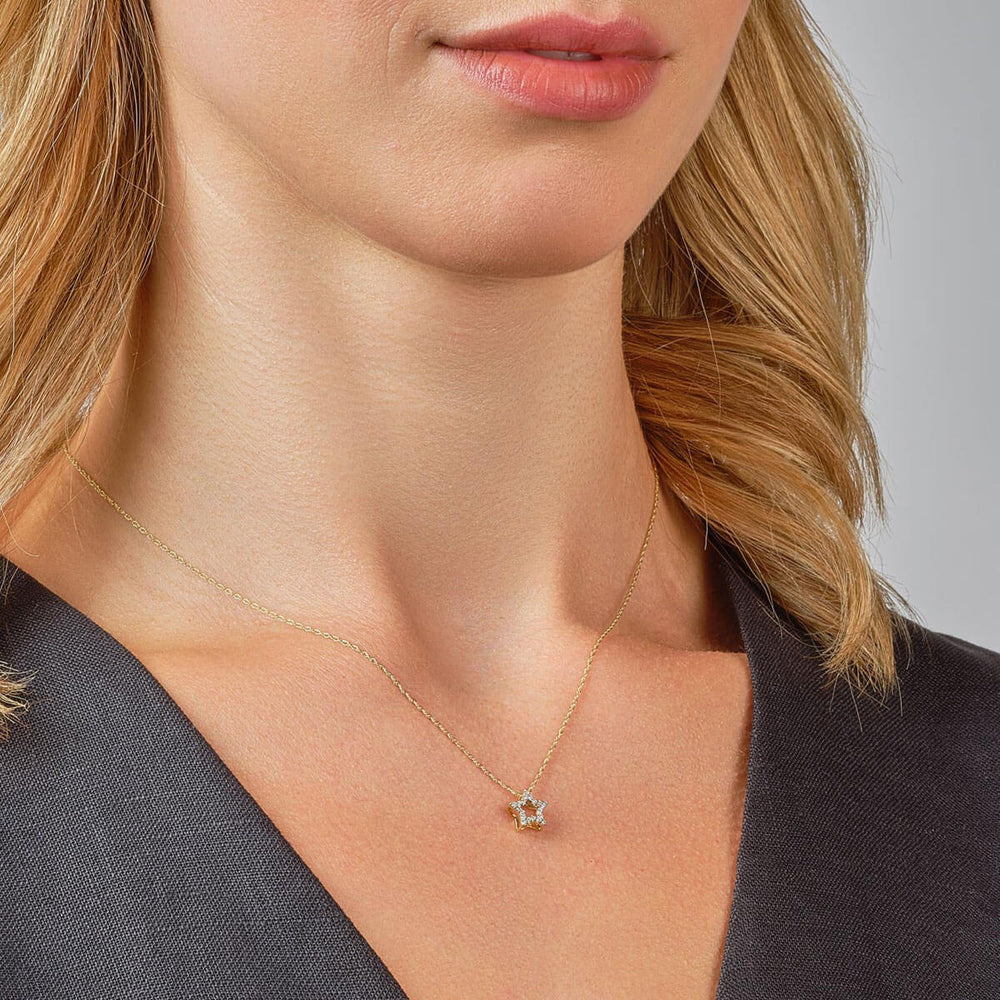 9ct yellow gold diamond star necklace on model