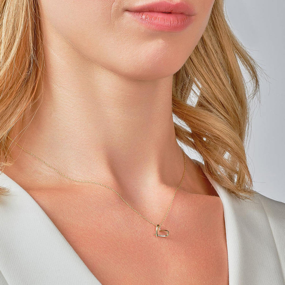 9ct yellow gold diamond heart necklace on model