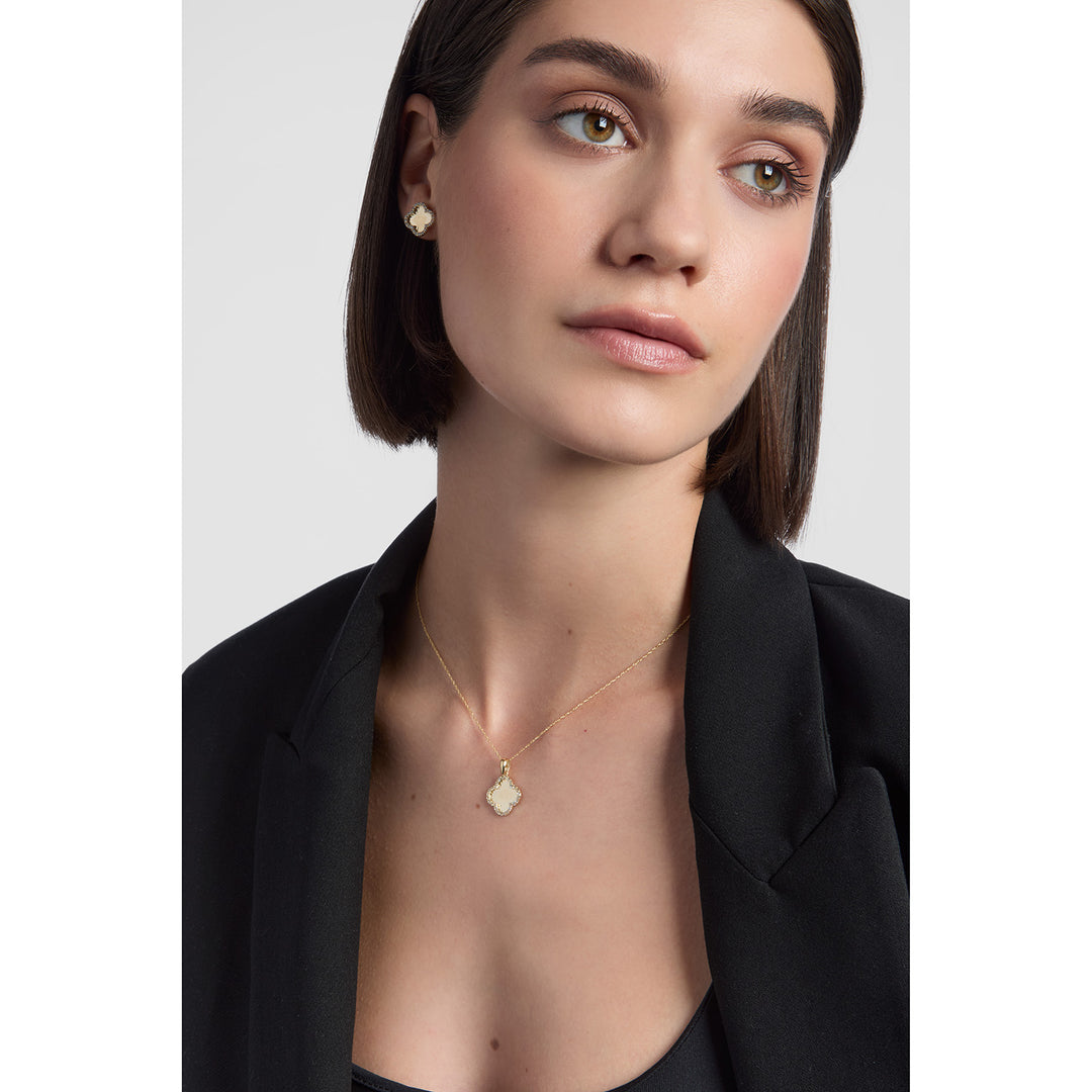 model wearing 9ct gold cubic zirconia clover stud earrings and necklace