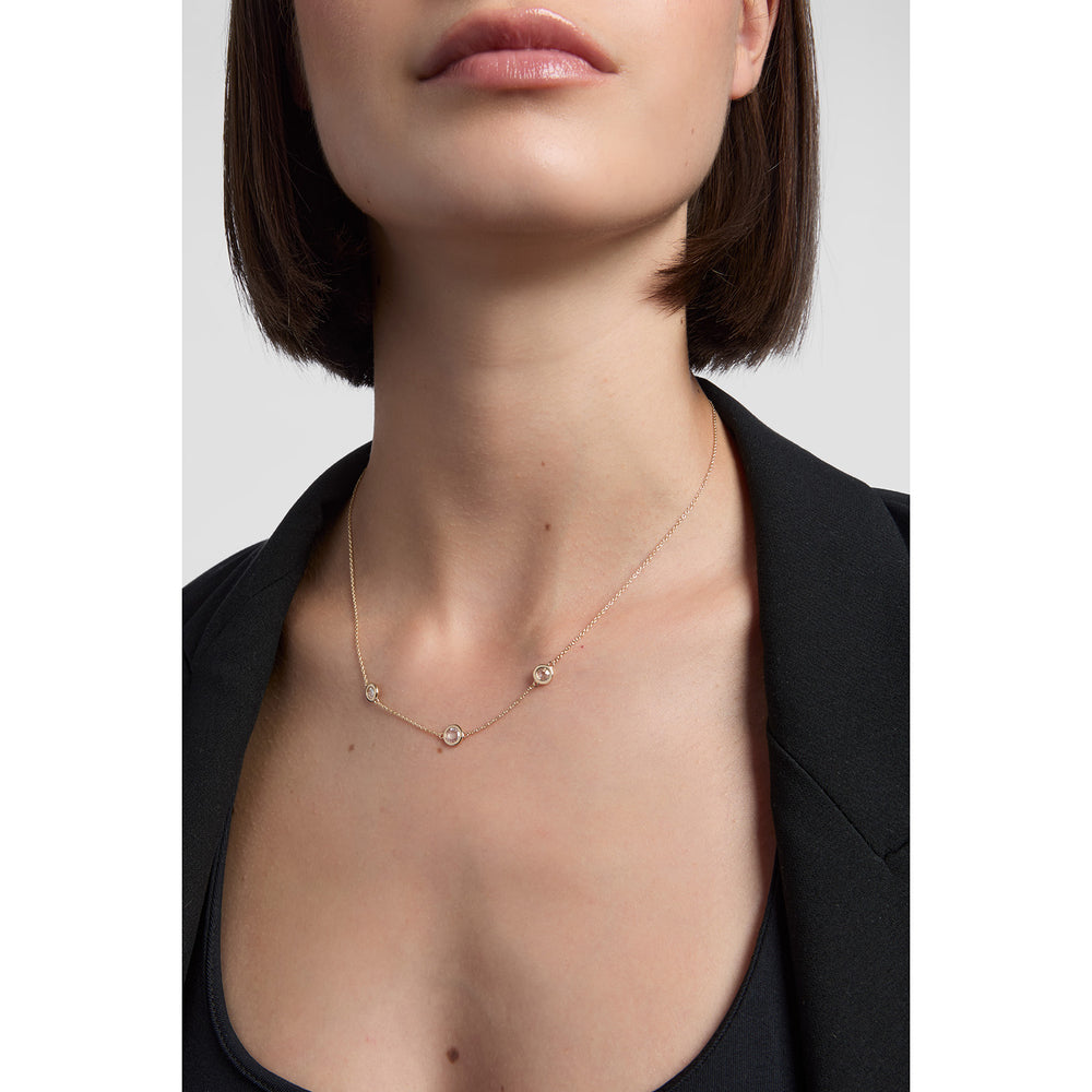 9ct yellow gold 3 stone rubover necklace on model