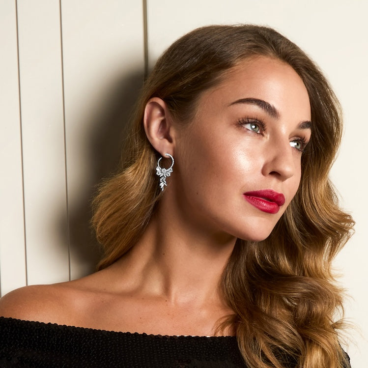 silver chandelier earrings on model