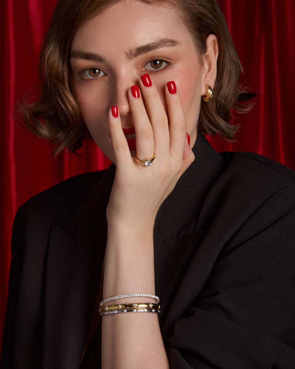 model wearing gold plated bracelet stack