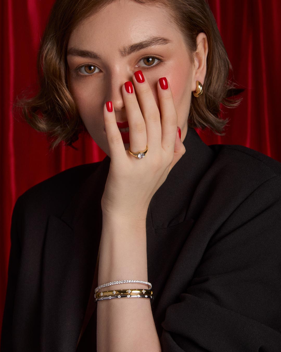model wearing gold plated bracelet stack
