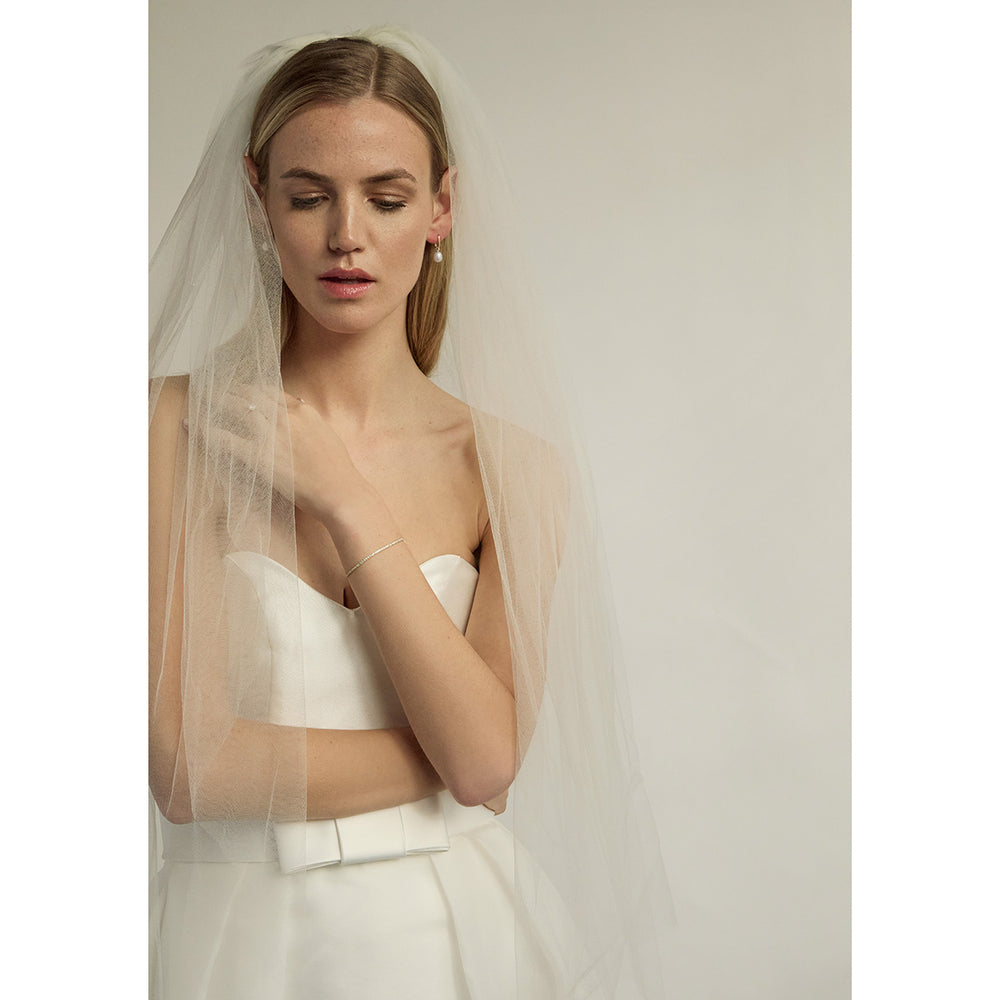 bridal jewellery on a model wearing white wedding dress