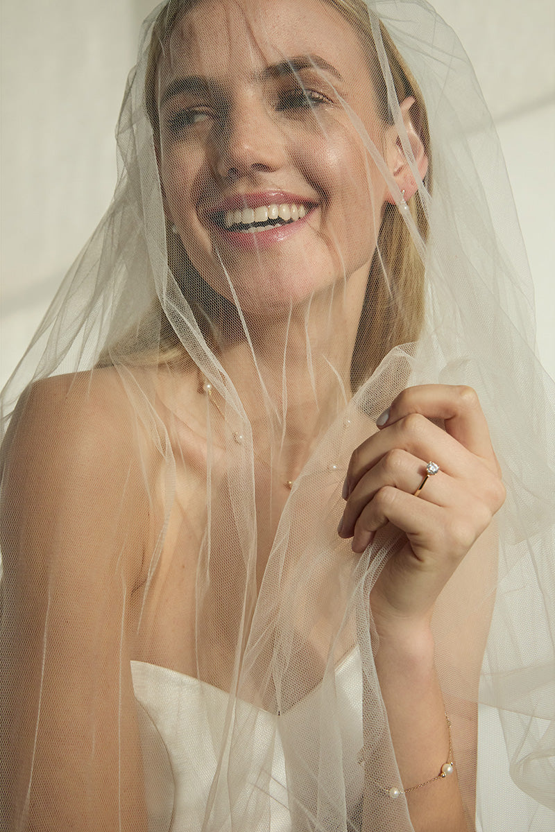 bride wearing 9ct gold pearl jewellery