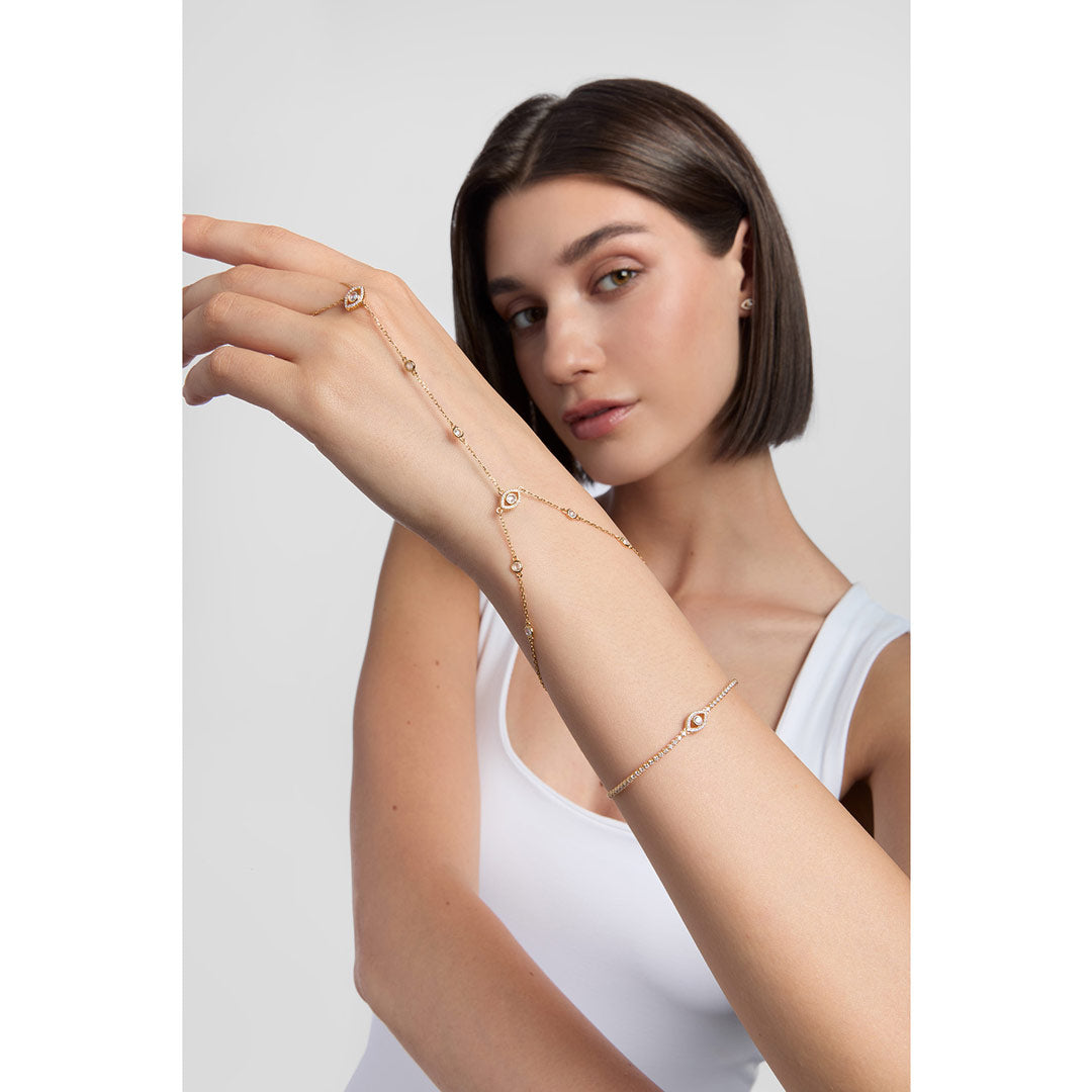gold evil eye cz hand chain bracelet on white background