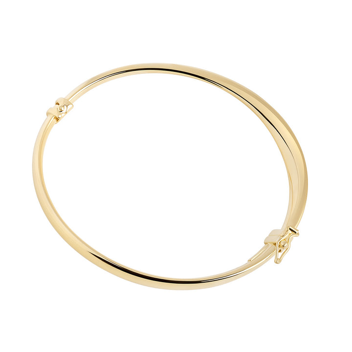 gold plated minimalist bangle on white background