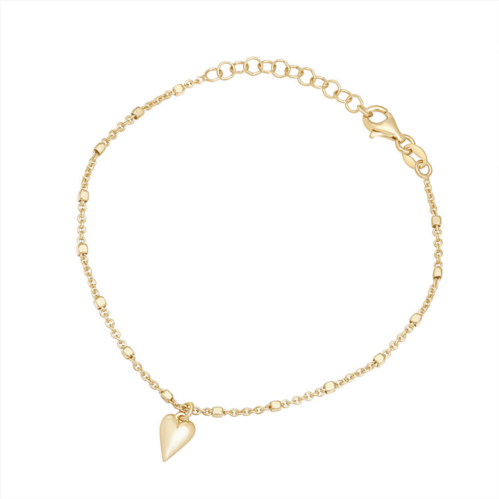 gold plated heart drop bracelet on white background