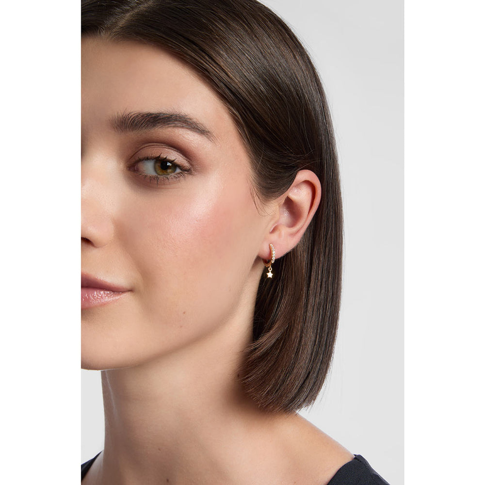 model wearing 18ct gold plated Star Drop Cubic Huggie Earrings