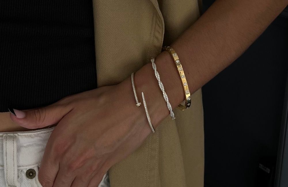 model wearing gold plated and sterling silver bangle stack