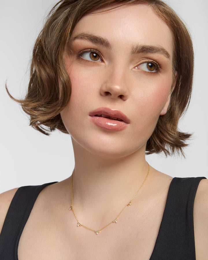 gold plated bar necklace on model