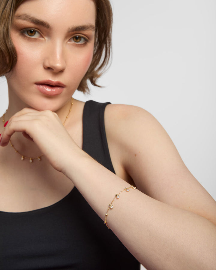 gold plated charm bracelet on model