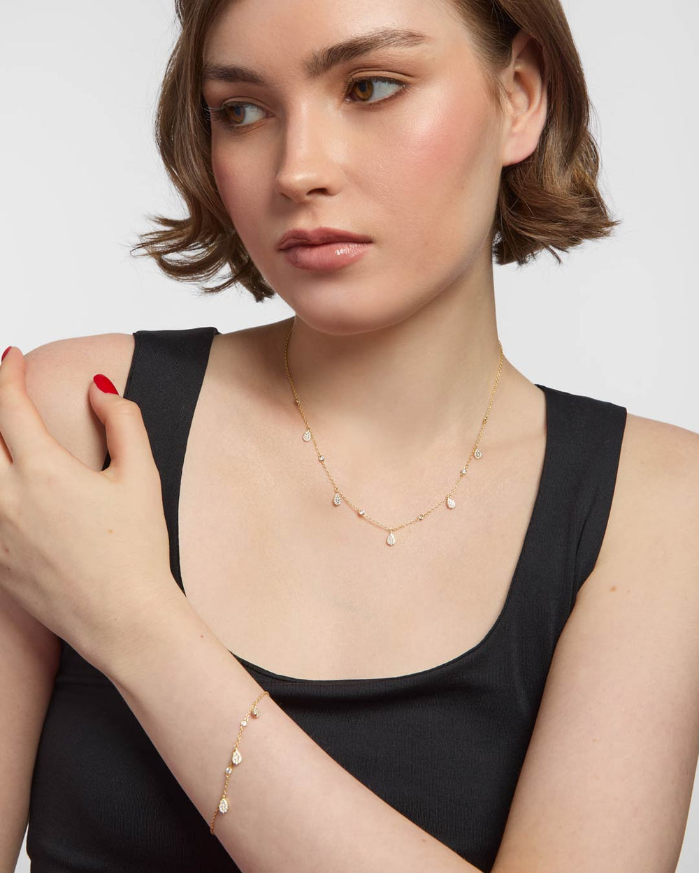 model wearing gold plated jewellery set