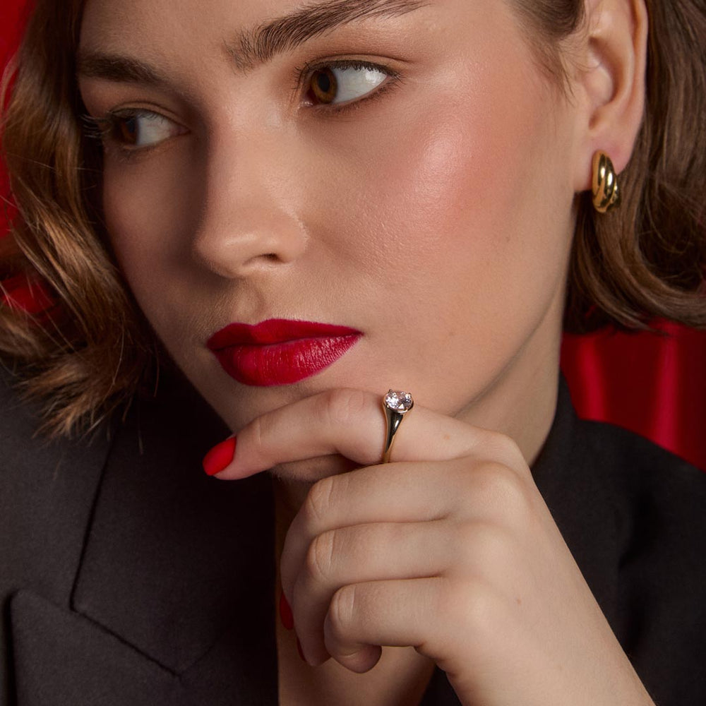 model wearing gold plated signet ring