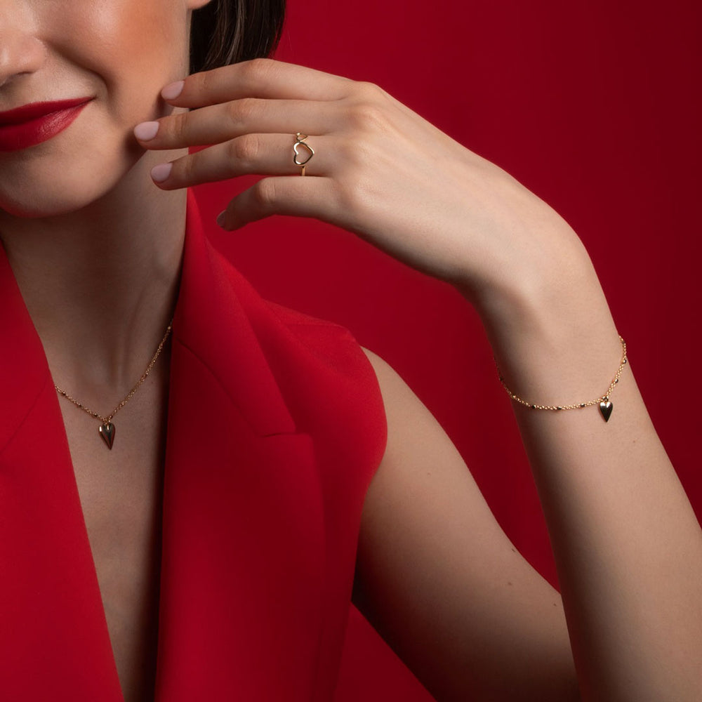 heart drop bracelet and necklace set on a model