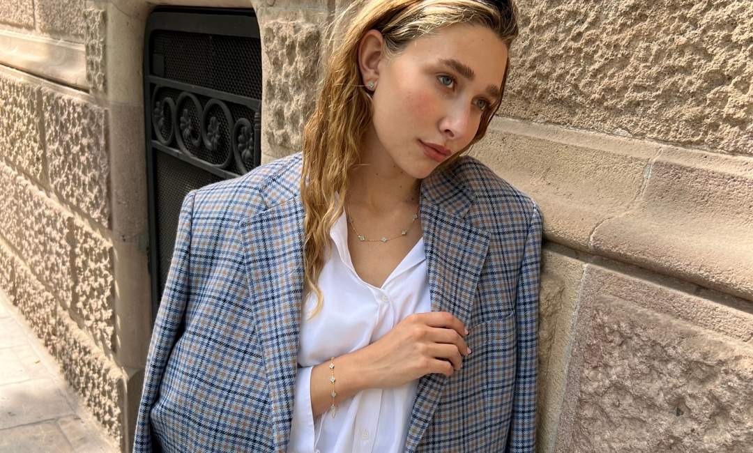 model wearing gold plated turquoise clover jewellery
