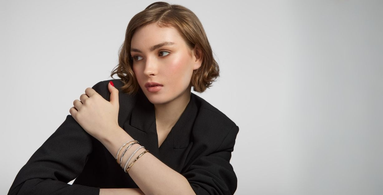 model wearing gold and silver bracelet stack