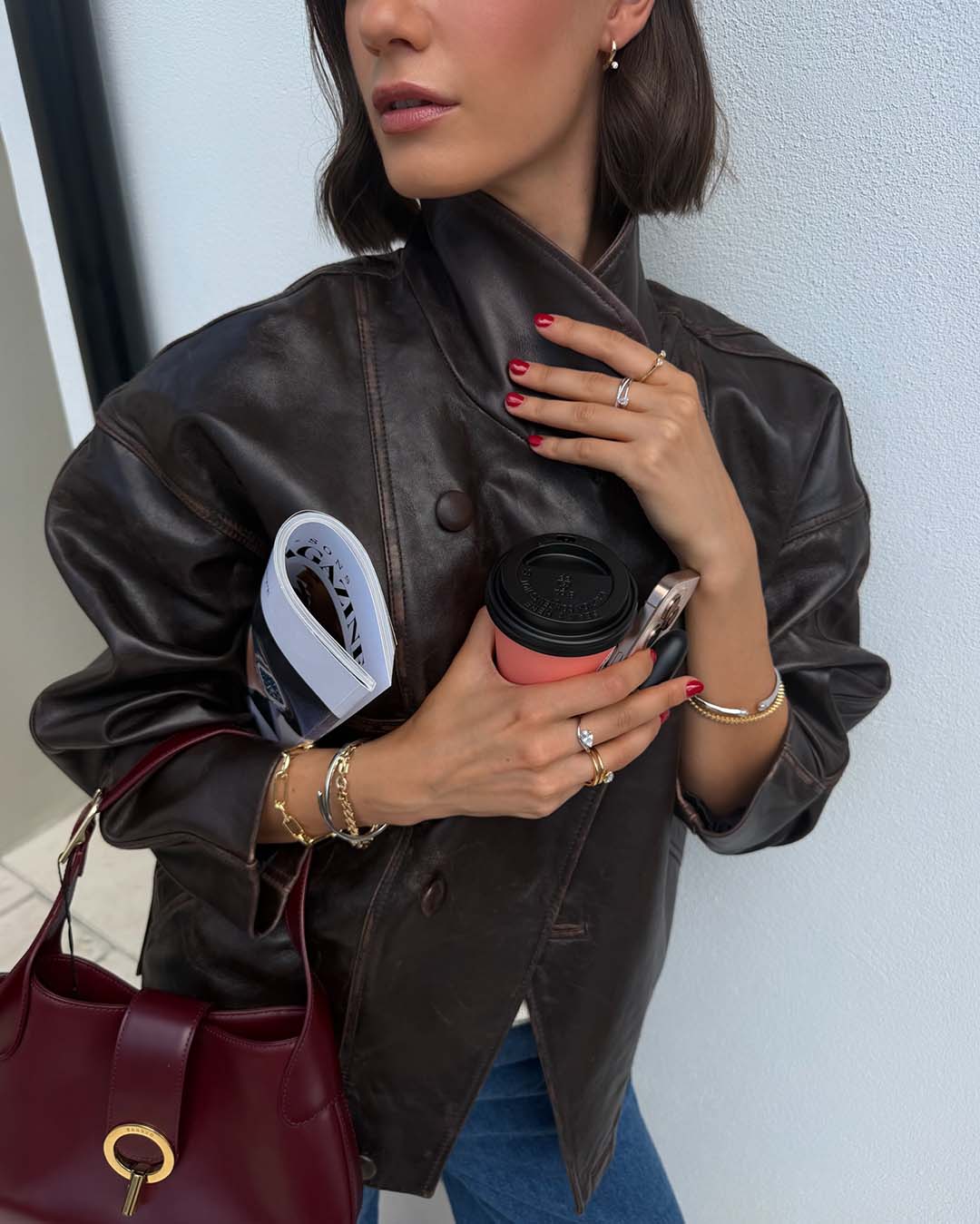 model wearing mixed metal bracelet stack and rings