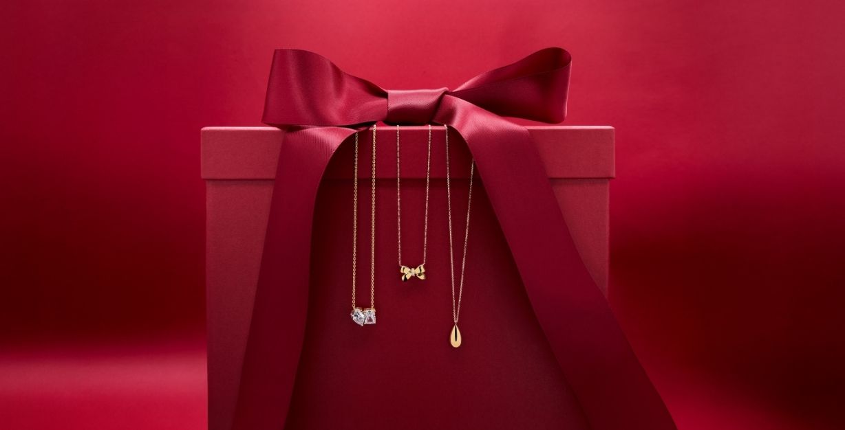 red present box with 9ct gold necklaces
