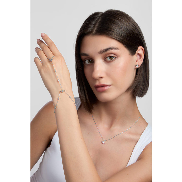 silver evil eye cz hand chain bracelet on white background