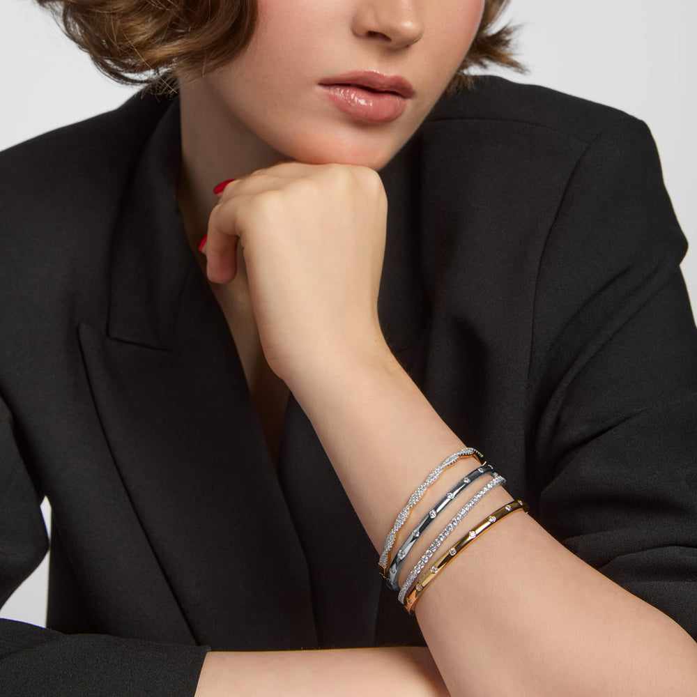 model wearing gold plated and sterling silver bracelet stack