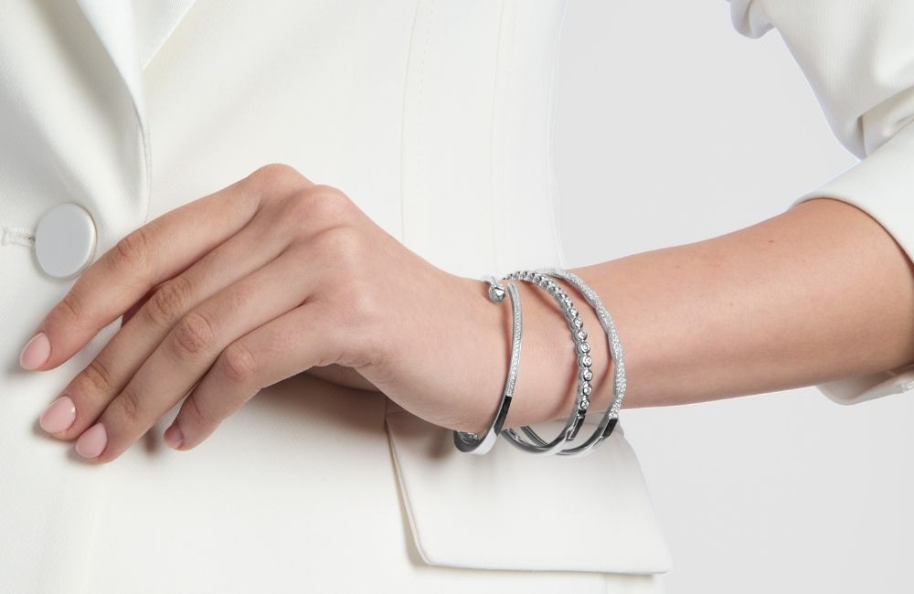 model wearing sterling silver bangle stack