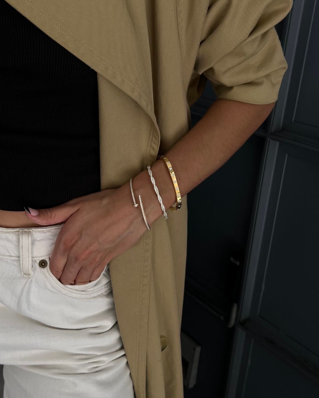 model wearing sterling silver and gold plated bracelet stack