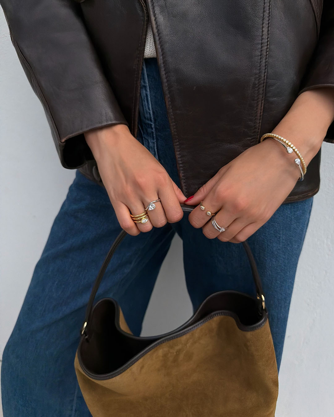 sterling silver and gold plated bracelets and rings on model