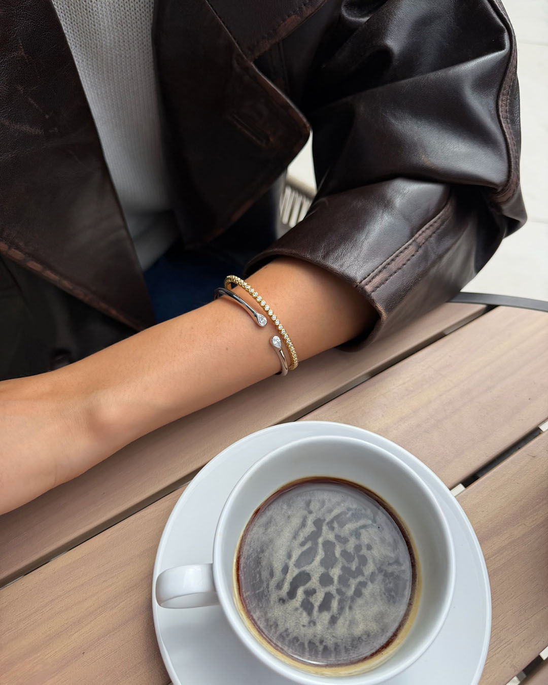 sterling silver and gold plated bracelets on model