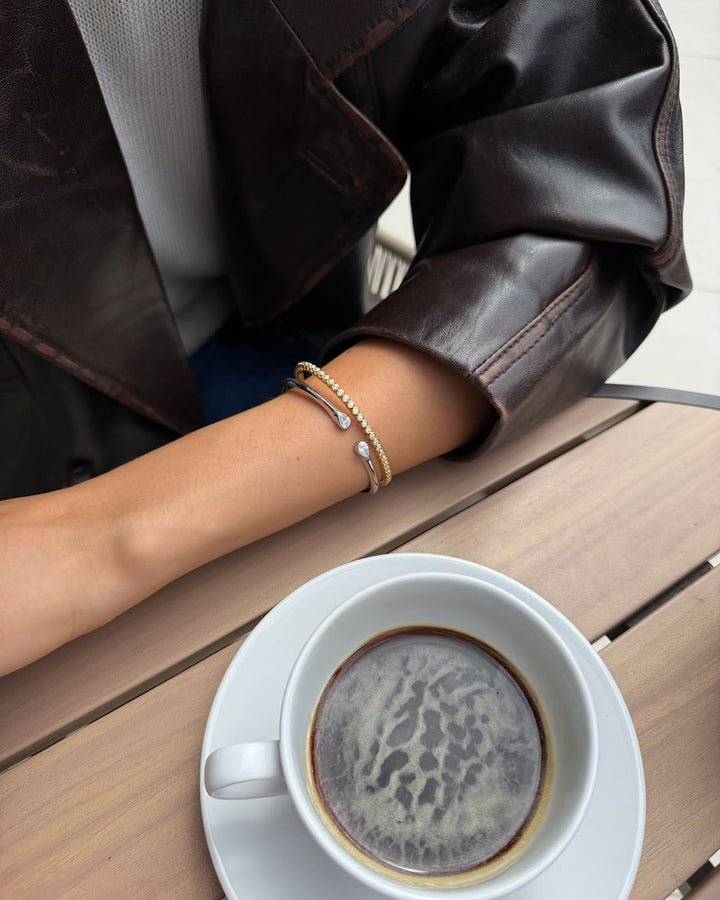 sterling silver and gold plated bracelets on model