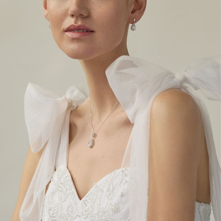 bride wearing sterling silver cz necklace and drop earrings