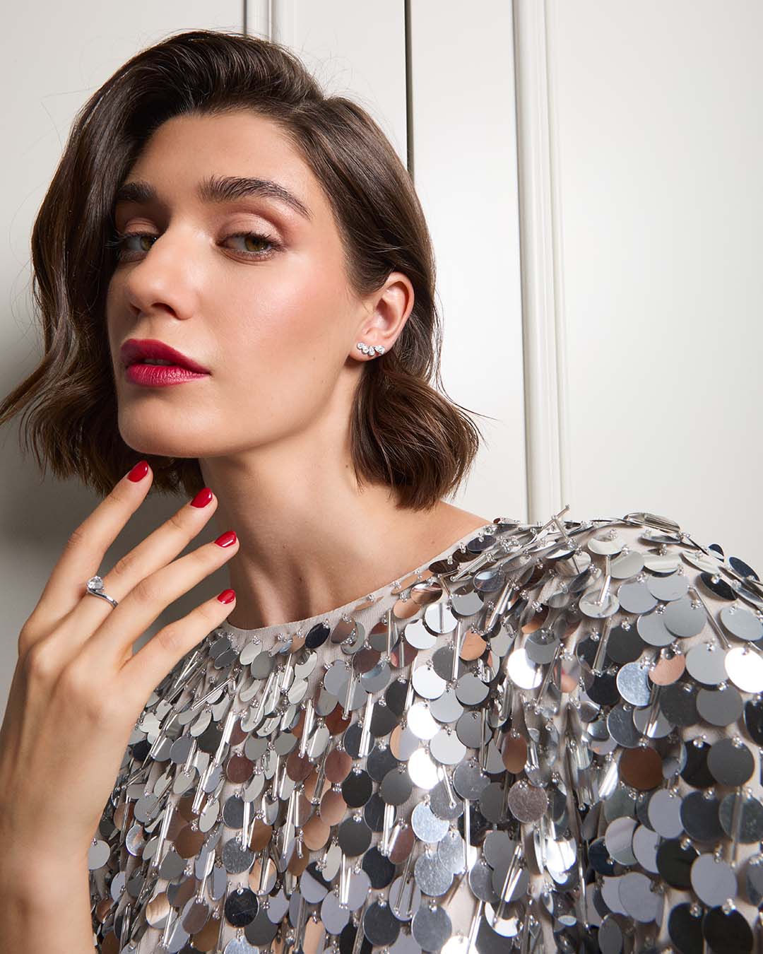 sterling silver climber earrings and ring on model