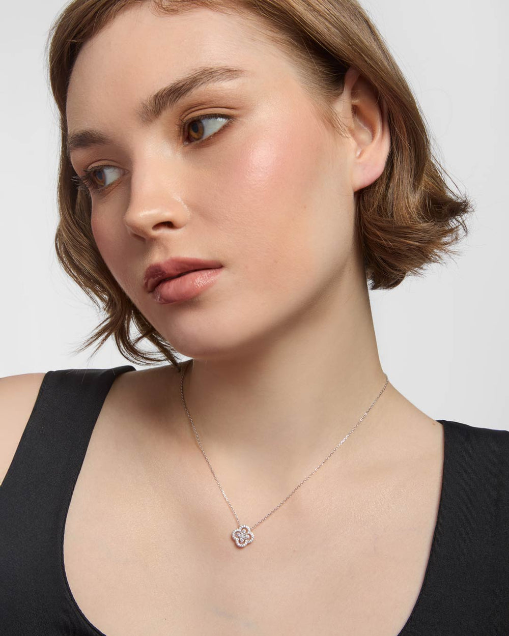 model wearing sterling silver clover necklace