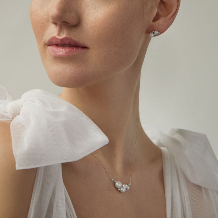 sterling silver pearl necklace and earrings on bride