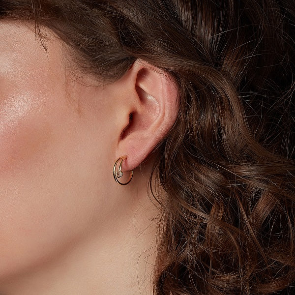 gold plated double hoop earrings on model