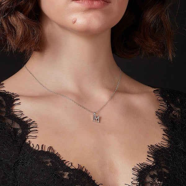 Model wearing initial pendant
