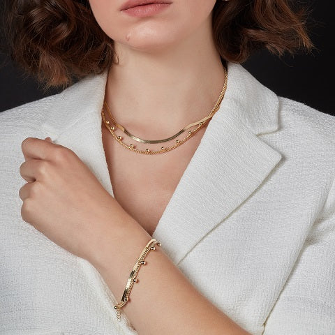 gold plated snake chain layered necklace on model