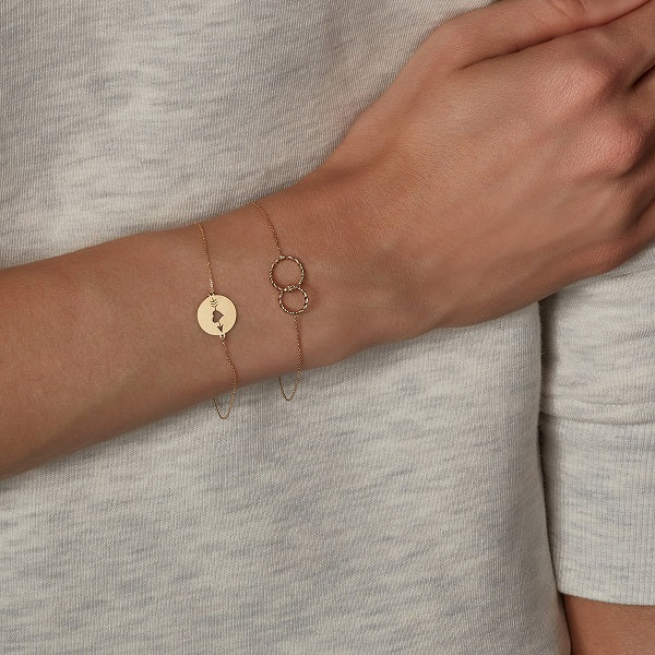 models wrist wearing 9ct gold bracelet by NJO designs 