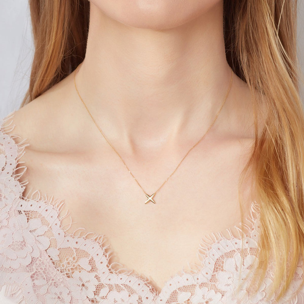 9ct yellow gold kiss necklace on model