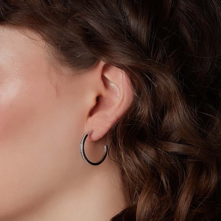 cz channel set hoop earrings on model