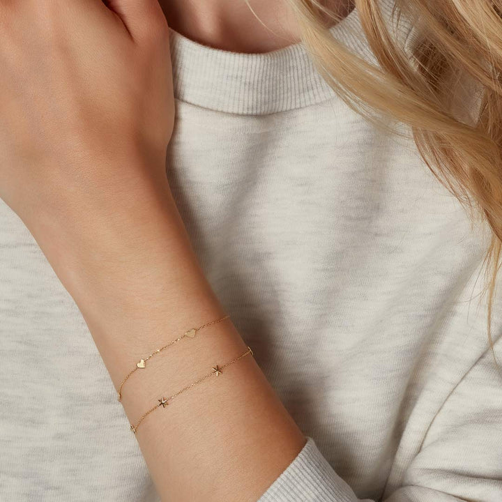 model wearing 9ct gold bracelet stack designed by NJO