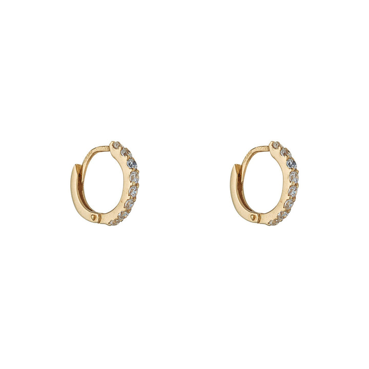 stock image of yellow gold cz huggie earrings on white background