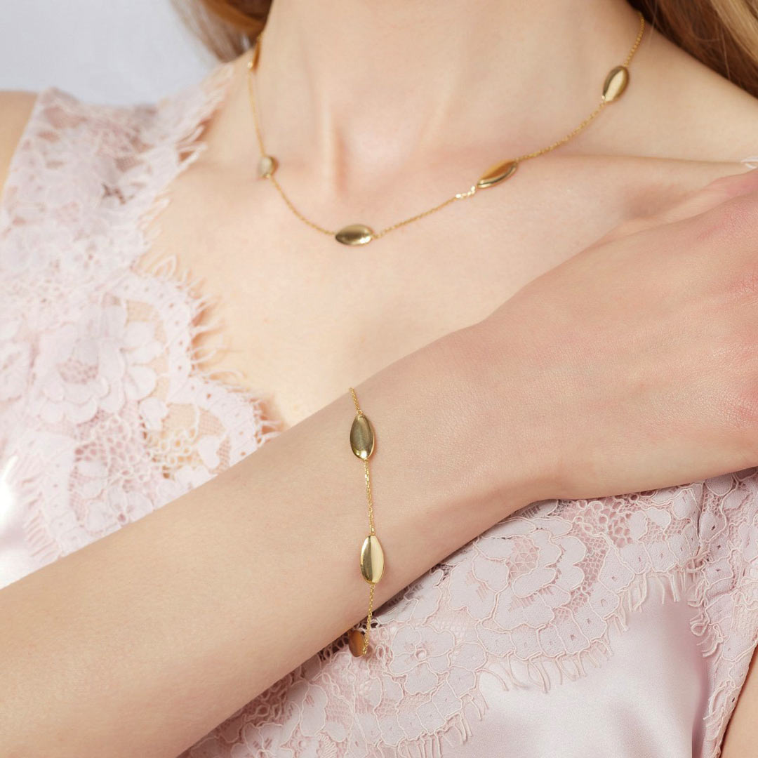 Model shot of oval design gold bracelet