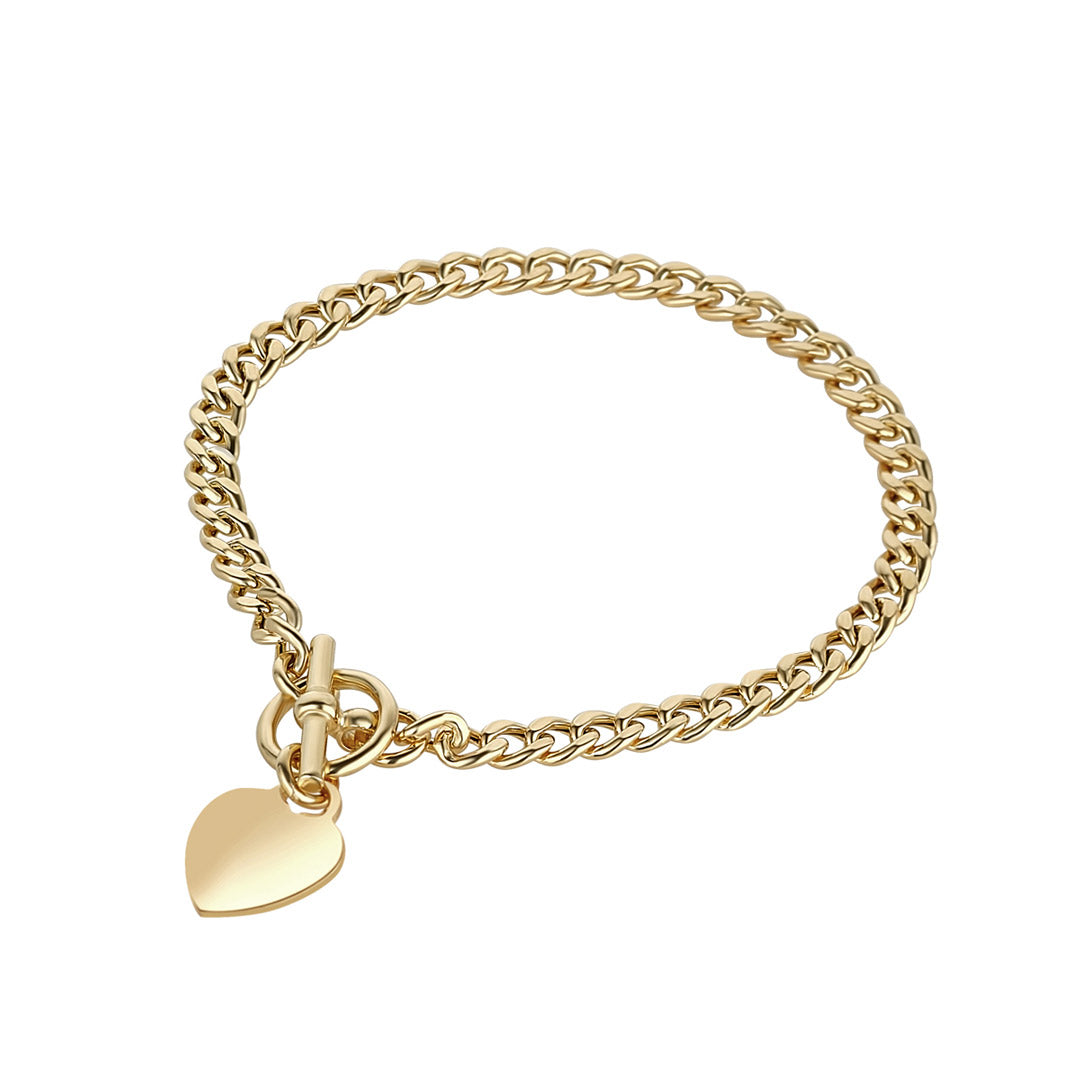 This image features a polished gold curb-chain bracelet secured with a T-bar toggle clasp that holds a smooth, reflective heart-shaped charm against a plain white background.
