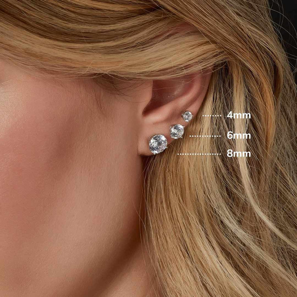 model wearing solitaire stud earrings