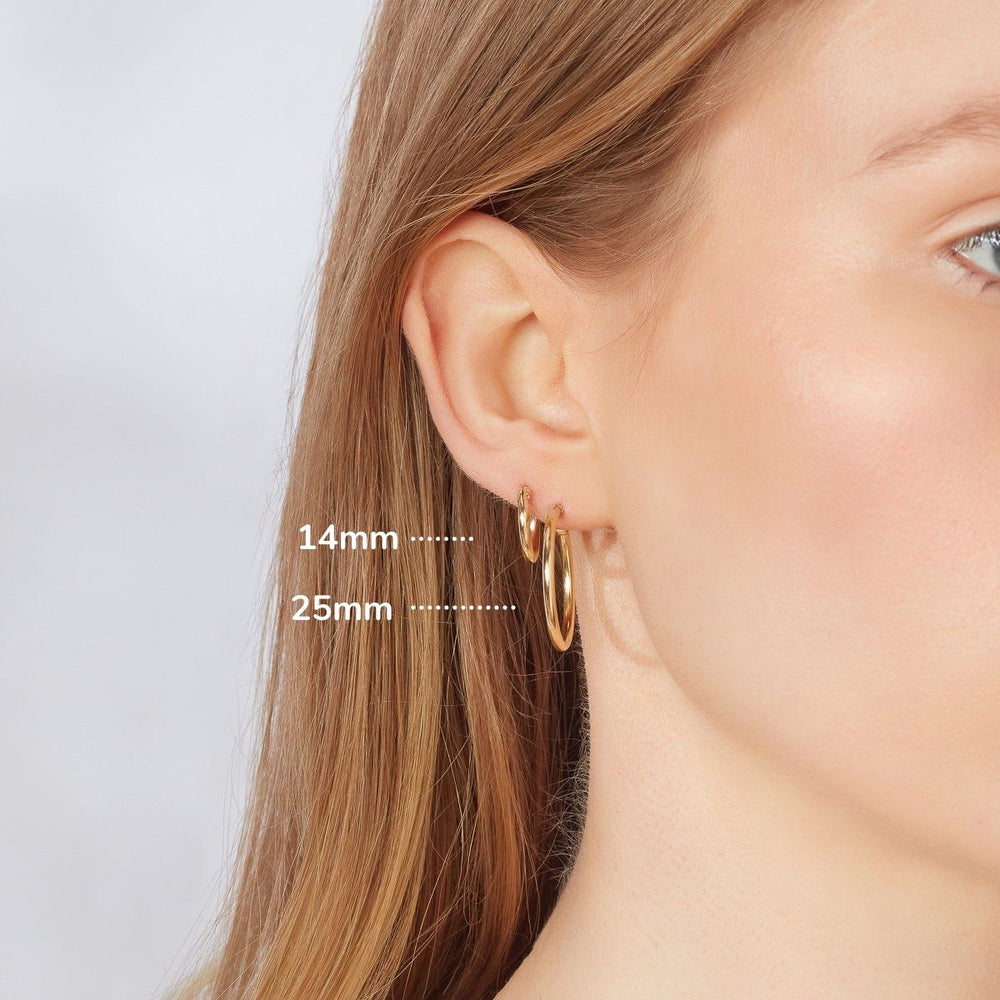 9ct gold hoop earrings on model